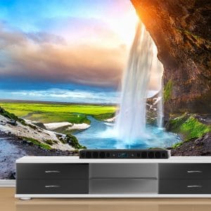 Iceland Cave Waterfall Landscape Wallpaper | Unique Nature Wall Decor Nepal | Iceland Wallpaper | Waterfall Cave Mural | Green Landscape Wall Art | Dramatic Sky Mural | Custom Mural Print Nepal | Custom Canvas Print Nepal